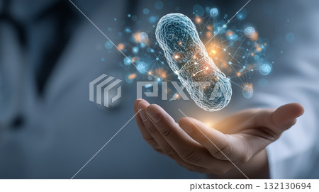 Medical professional holding a glowing bacteria model with digital connections in a healthcare setting 132130694