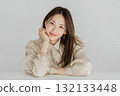 Smiling young woman talking for counseling or interview 132133448