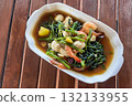 Adobong Kangkong Filipino hot salad with spinach, vegetables, and shrimp 132133955
