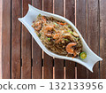Pansit Canton Bihon, Filipino rice and egg noodles with vegetables, meat, and seafood, served with shrimp and calamansi 132133956