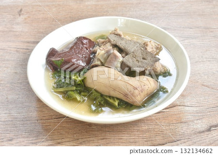 boiled pork blood and entrails with chop pork topping lettuce in soup on plate boiled pork blood and entrails with chop pork topping lettuce in soup on plate 132134662
