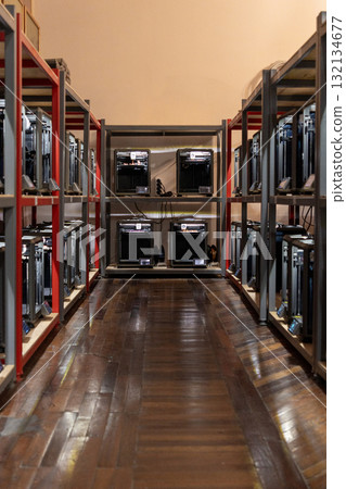 room with a large number of 3D printers, the creation of three-dimensional toys and parts 132134677