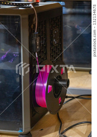 3D-printed plastic spools with thread for creating toys and three-dimensional parts. 132134678