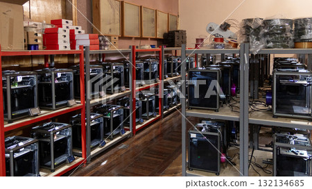 room with a large number of 3D printers, the creation of three-dimensional toys and parts 132134685