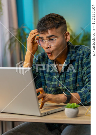 Frustrated business man having software problems with laptop error or mistake virus notification Frustrated business man having software problems with laptop error or mistake virus notification 132135104
