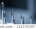 Close up scene the group taper endmill tool for CNC milling machine in the blue tone scene. 132135307