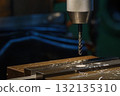 The tapping process the metal plate on CNC milling machine. 132135310
