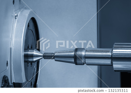 Close up scene the cylindrical surface grinding machine in the light blue scene. Close up scene the cylindrical surface grinding machine in the light blue scene. 132135311