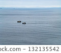 Two trawler pulling one big net to catch sprat in Donegal Bay within the six nautical mile zone, Ireland 132135542