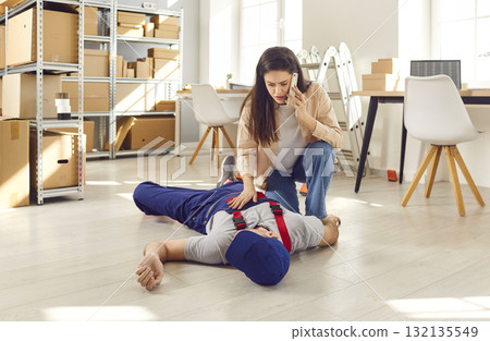 Woman Calls Emergency For Unconscious Worker At Warehouse Woman Calls Emergency For Unconscious Worker At Warehouse 132135549