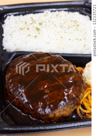 A delicious hamburger bento with potato salad and Neapolitan pasta as side dishes 132135721