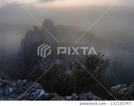 Fog in the high mountains in sunrise 132135747