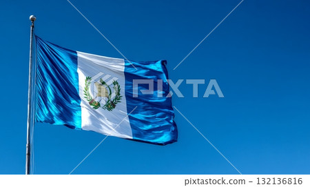 Celebrating Lithuanias independence day with the national flag waving proudly against a clear blue sky 132136816