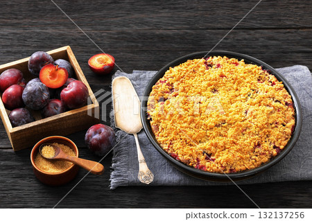 Crumb topped Plum Pie in a baking dish 132137256