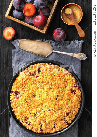 Crumb topped Plum Pie in a baking dish 132137258