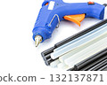 Hot Glue Gun with Black and White Glue Sticks on White Background 132137871