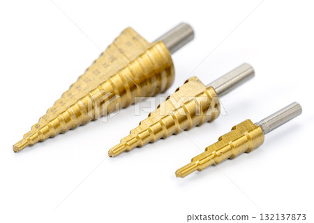 Three Metal Step Drill Bits in Various Sizes on White Background 132137873