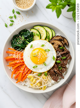 Korean Bibimbap Rice Bowl with Fried Egg and Vegetables 132138569