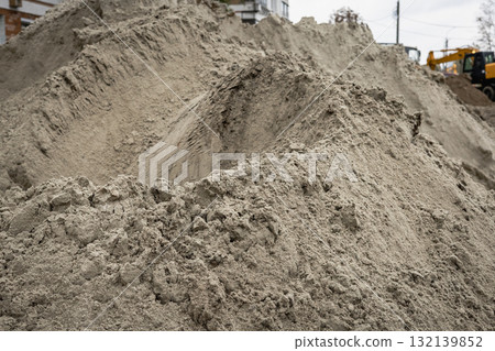 Construction site with large piles of sand and gravel during daylight hours Construction site with large piles of sand and gravel during daylight hours 132139852
