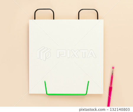 School background with empty white sheet of paper and pen. School supplies on a ivory background with copy space. School concept. Flat lay 132140803