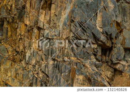 Rugged rock formation in mountainous outdoor setting 132140826