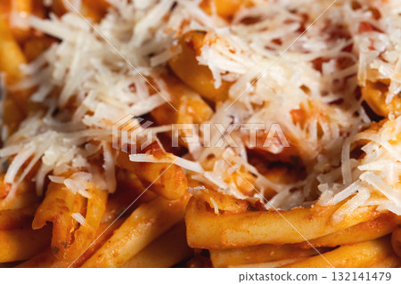 Casarecce pasta with tomato sauce and grated cheese 132141479