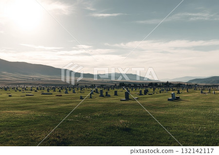 Cemetery Landscape With Headstones Under a Clear Sky and Mountains in the Background During Daylight Cemetery Landscape With Headstones Under a Clear Sky and Mountains in the Background During Daylight 132142117