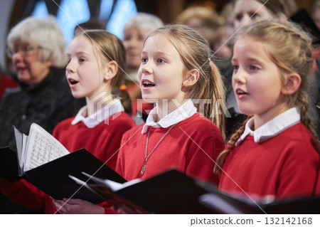 Young Singers Perform During a Choir Concert in a Church 132142168