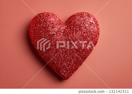 Bright Red Glitter Heart on a Soft Pink Background for Festive Occasions 132142311