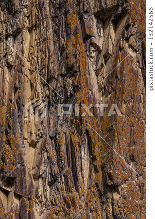 Rugged rock formation in mountainous outdoor setting Rugged rock formation in mountainous outdoor setting 132142566