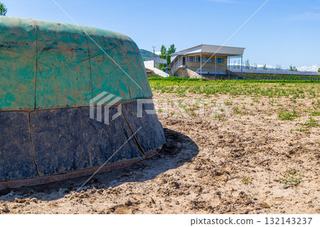 Green kazan in Kok-Boru stadium at sunny summer day. Green kazan in Kok-Boru stadium at sunny summer day. 132143237