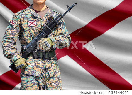 Alabama US state flag with soldier holding assault rifle 132144091