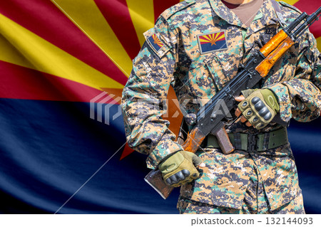 Arizona US state flag with soldier holding assault rifle 132144093