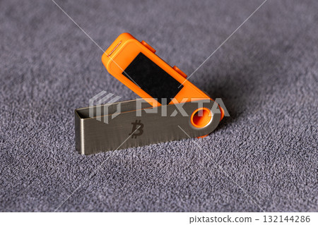 hardware wallet on table indoors with neutral background hardware wallet on table indoors with neutral background 132144286