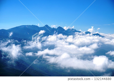 Summer view of the Yatsugatake mountain range with a sea of clouds from the summit of Mt. Tateshina Ver.1 132144880