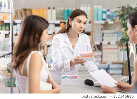 Pharmacist gives mother and daughter prescription pills Pharmacist gives mother and daughter prescription pills 132146696
