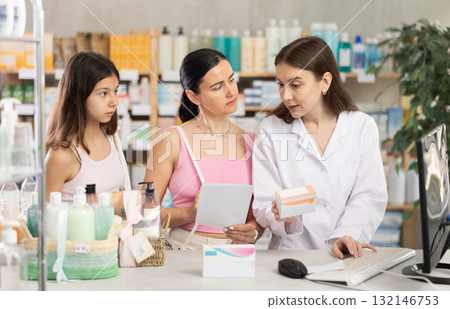 Pharmacist gives mother and daughter prescription pills Pharmacist gives mother and daughter prescription pills 132146753