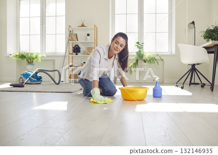Positive Woman Cleaning the Floor Positive Woman Cleaning the Floor 132146935