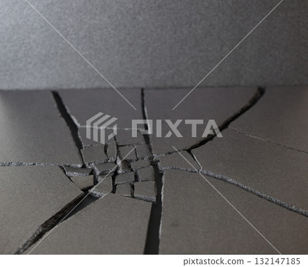 Cracked black ground Cracked black ground 132147185