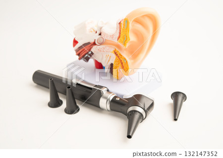 Otoscope with model for audiologist or ENT doctor use otoscope checking ear and treat hearing loss problem. Otoscope with model for audiologist or ENT doctor use otoscope checking ear and treat hearing loss problem. 132147352