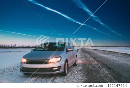 Car Sedan In Country Road At Winter Evening 132147514