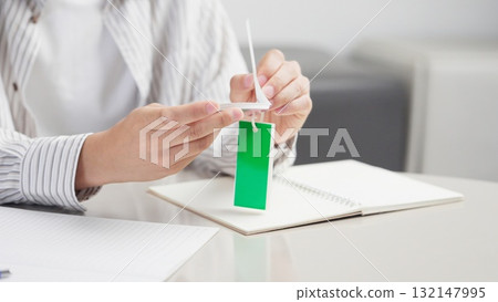 Hands of an Asian man learning words Hands of an Asian man learning words 132147995