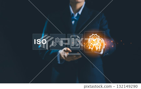 Person touching certificate icon represents concept of certification and standardization, business achieves ISO certified status quality assurance process in conformity with international standards. 132149290