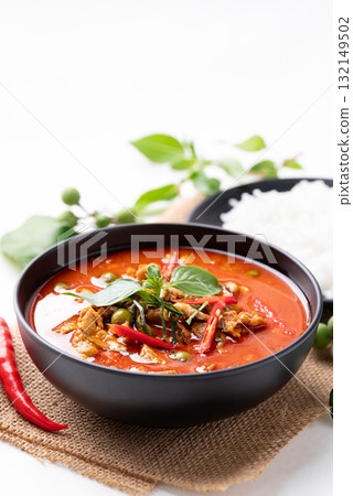Thai red curry with pork and cooked rice with ingredients on white background 132149502