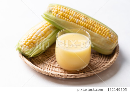 Sweetcorn milk in glass and fresh sweetcorn, Alternative milk from plant, dairy free Sweetcorn milk in glass and fresh sweetcorn, Alternative milk from plant, dairy free 132149505