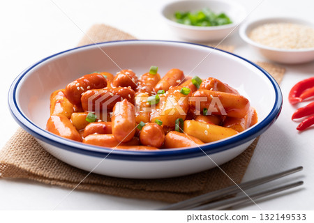 Korean Tteokbokki (simmered rice cake) and sausage with spicy sauce Korean Tteokbokki (simmered rice cake) and sausage with spicy sauce 132149533
