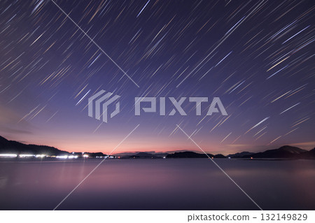 Winter starry scenery of Setouchi: Star trails in the twilight sky Winter starry scenery of Setouchi: Star trails in the twilight sky 132149829