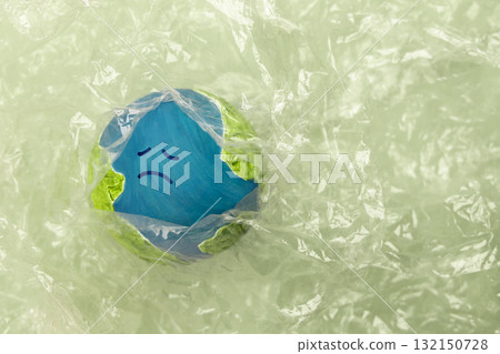 Sadness Globe wraped by Plastic materials. Environmental Issue Concept 132150728