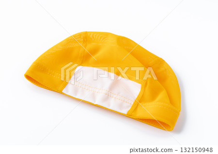 Children's yellow swimming cap on a white background 132150948