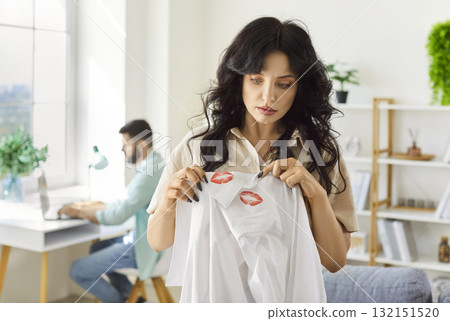 Woman discovers lipstick on partners shirt, sparking argument and trust issues Woman discovers lipstick on partners shirt, sparking argument and trust issues 132151520